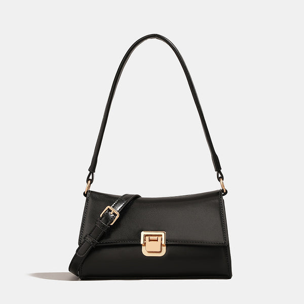Compact structured flap shoulder bag with gold-tone turn-lock closure and adjustable strap, front view