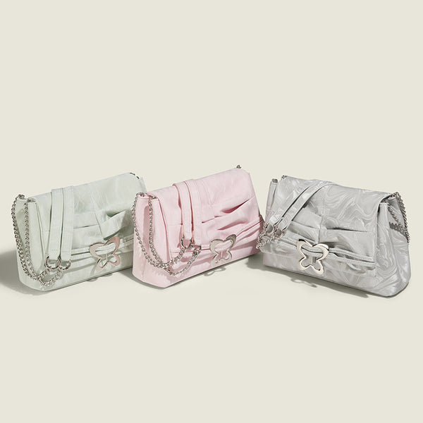 Structured rectangular chain shoulder bag with silver butterfly clasp and glossy crinkled finish, detail view 2