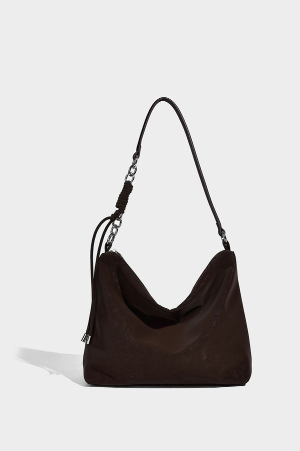 Slouchy matte-finish hobo shoulder bag with tassel cords, silver-tone hardware, and faux-fur pom charm, detail view 13