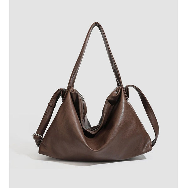 Slouchy leather-look hobo shoulder bag with top zipper and silver-tone hardware, detail view 5