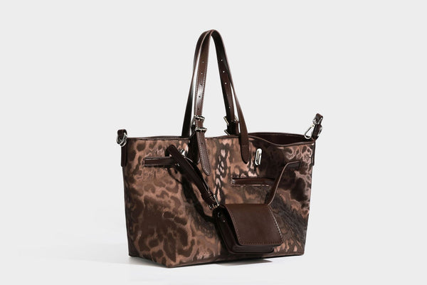 Glossy leopard-print tote bag with leather-look dark trim, dual top handles, detachable shoulder strap, and attached front