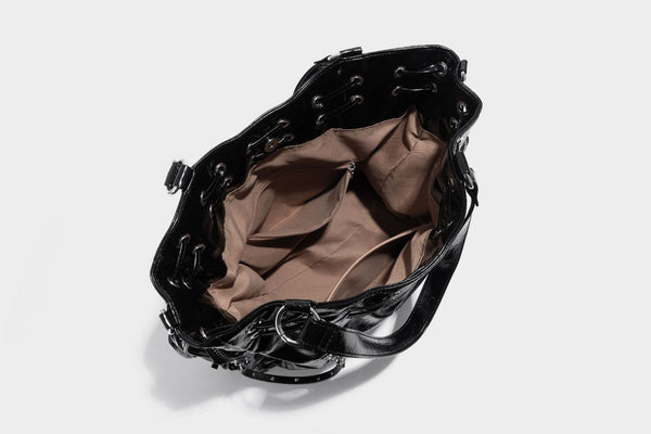 Glossy crinkled leather-look tote bag with silver grommet lace-up front detail, dual top handles, and detachable shoulder