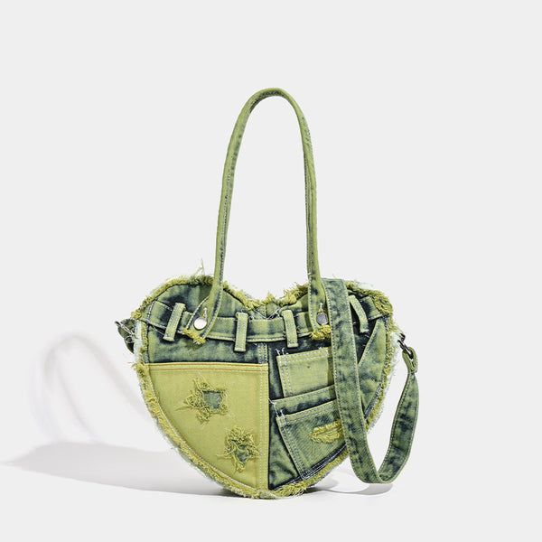 Heart-shaped patchwork washed denim shoulder bag with frayed edges, front patch pockets, and metal hardware, detail view 7