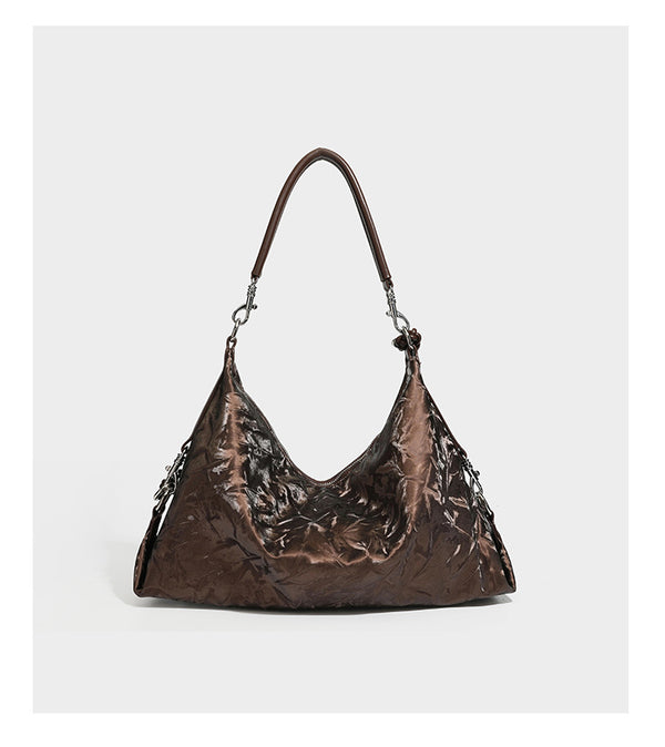 Slouchy hobo shoulder bag in crinkled metallic brown leather-look finish with braided rope knots, silver-tone hardware