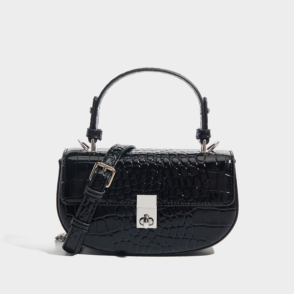 Glossy croc-embossed mini saddle bag with silver-tone turn-lock clasp and short top handle, detail view 7