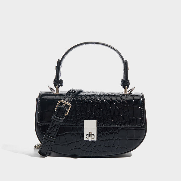 Glossy croc-embossed mini saddle bag with silver-tone turn-lock clasp and short top handle, detail view 7