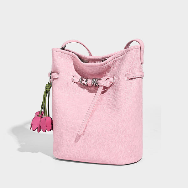 Small pebbled leather-look bucket bag with front drawstring toggle hardware and long adjustable shoulder strap, detail view 7
