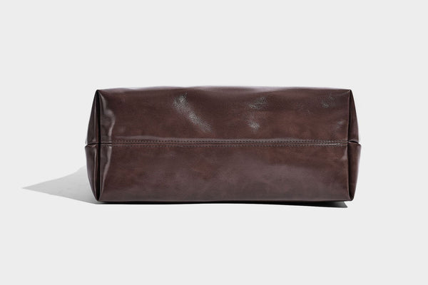 Glossy oil-wax leather-look open-top tote shoulder bag with embossed circular logo and long double straps, detail view 28