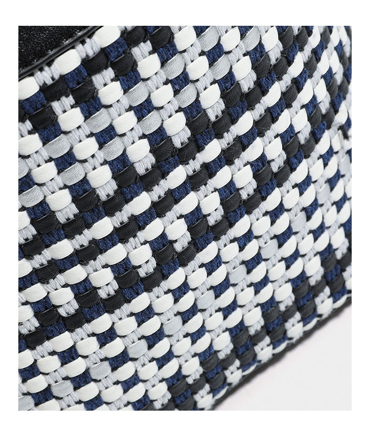 Small structured woven checker bucket bag with braided top handle, drawstring closure, and silver-tone hardware in black