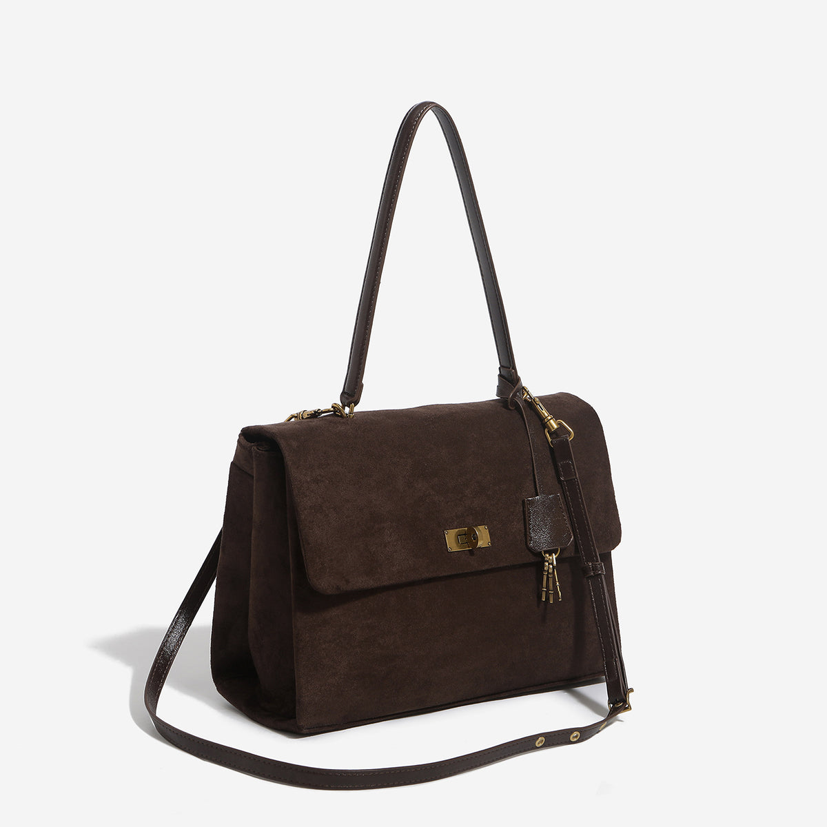 Large structured dark brown suede-finish satchel bag with gold-tone turn-lock closure, key charm accent, and detachable