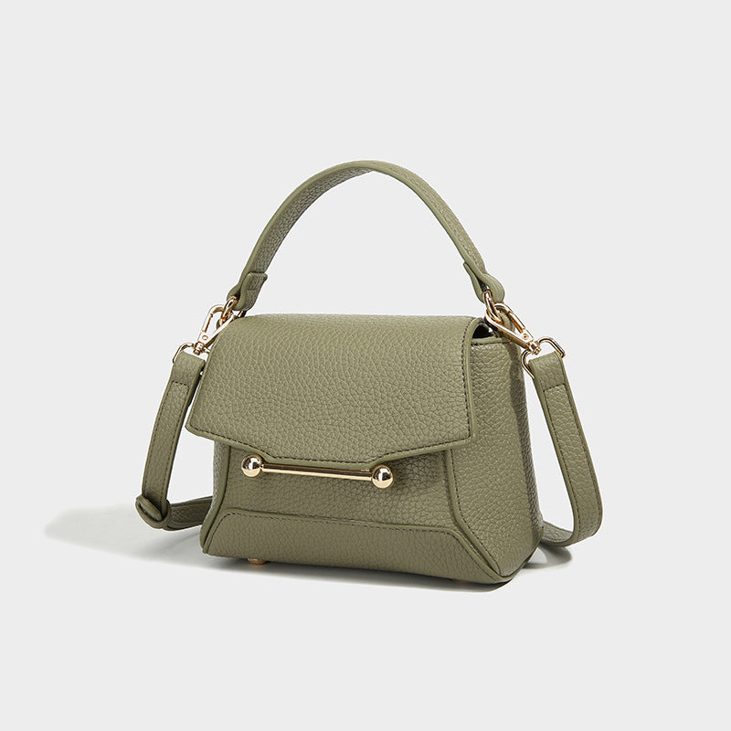 Small structured pebbled flap mini satchel with gold-tone bar hardware, short top handle, and detachable crossbody strap