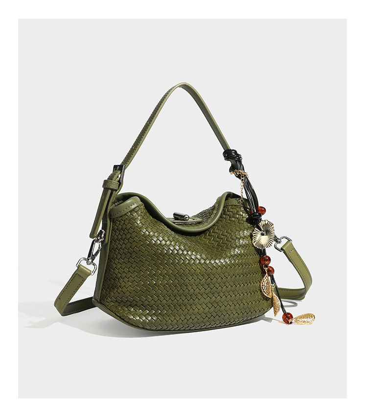 Small woven-look leather-look flap shoulder hobo bag in burgundy with silver-tone hardware and decorative tassel charm