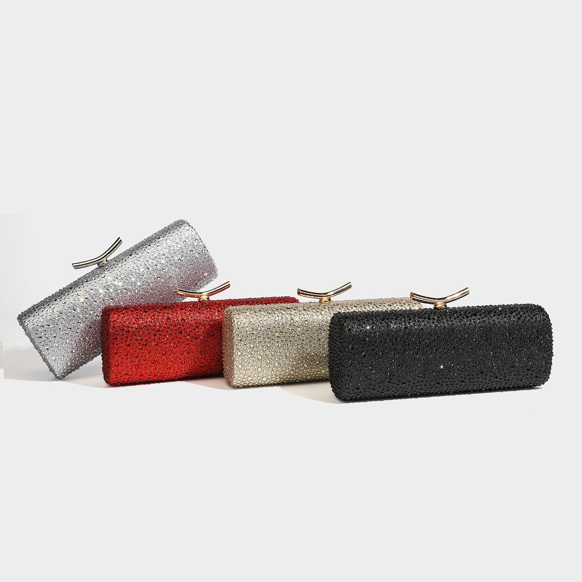 Structured rectangular hard-case clutch bag covered in all-over rhinestone crystal embellishment with curved kiss-lock top