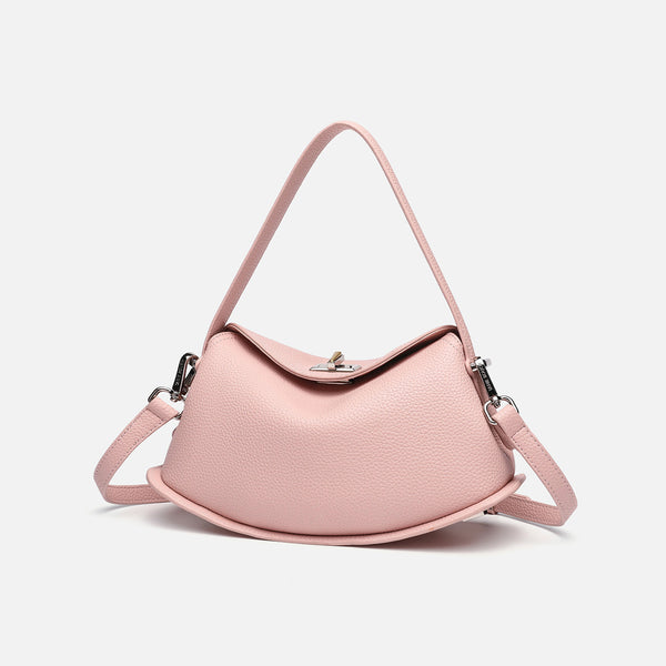 Pebbled leather-look half-moon saddle bag with turn-lock flap closure, top handle, and detachable crossbody strap, detail