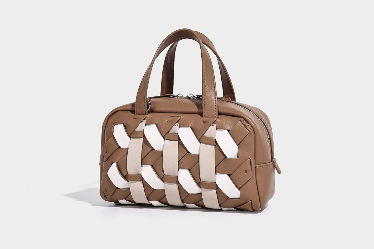 Small structured satchel bag with two-tone woven front panel, dual top handles, and detachable crossbody strap in tan brown