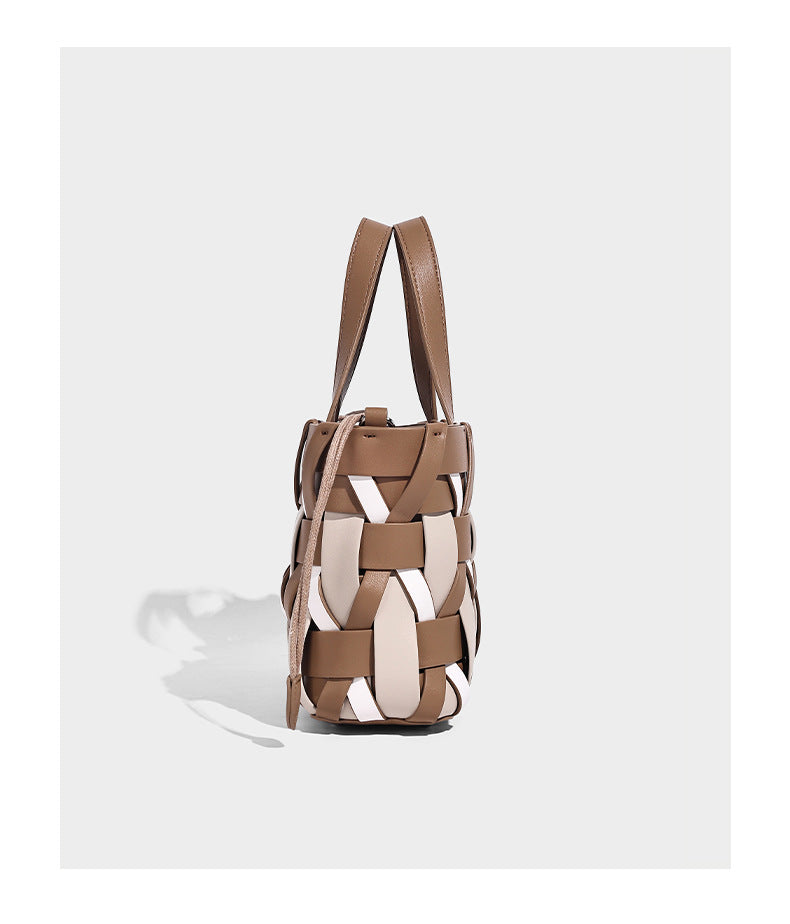 Small structured woven lattice tote bag with dual top handles and detachable shoulder strap in brown and cream leather-look