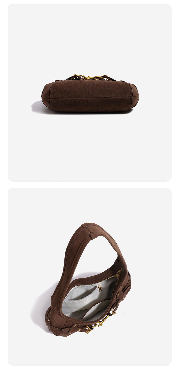 Slouchy hobo shoulder bag with gold-tone ring-and-buckle front hardware, zip top closure, and matte textured finish, detail