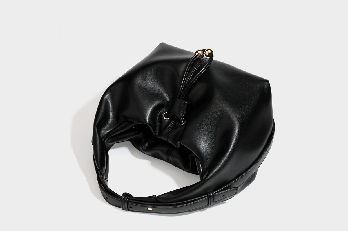 Slouchy hobo bag with smooth leather-look finish, drawstring cinch closure, and gold-tone bead hardware, detail view 32
