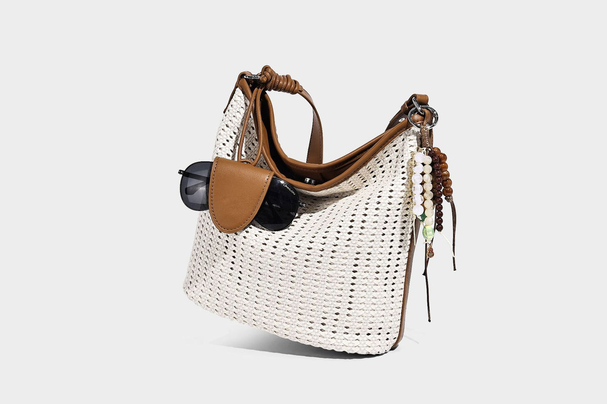 Slouchy open-weave hobo shoulder bag with leather-look trim, beaded tassel charm, and adjustable strap, detail view 16