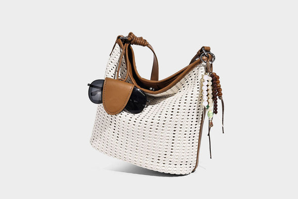 Slouchy open-weave hobo shoulder bag with leather-look trim, beaded tassel charm, and adjustable strap, detail view 16