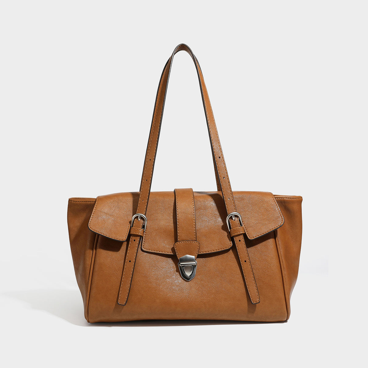 Large structured vintage-style tote bag with flap-front turn-lock closure, twin buckle straps, and double shoulder handles
