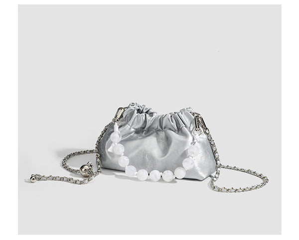 Small ruched drawstring pouch bag with pearl-bead handle and silver-tone chain strap, detail view 9