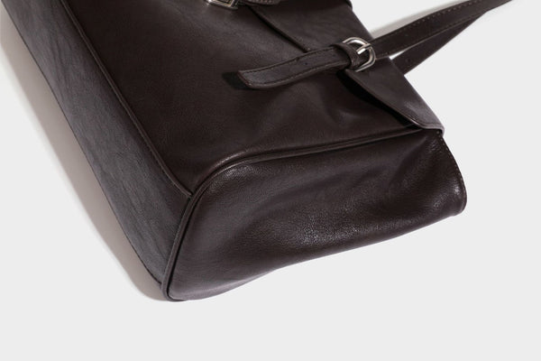 Large structured vintage-style tote bag with flap-front turn-lock closure, twin buckle straps, and double shoulder handles