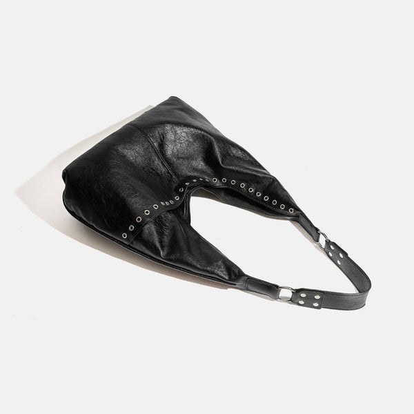 Large slouchy hobo shoulder bag with silver eyelet trim and glossy leather-look finish, detail view 4