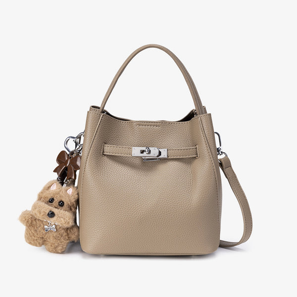 Compact structured bucket bag in pebbled leather-look finish with silver turn-lock front clasp, dual top handles, detachable