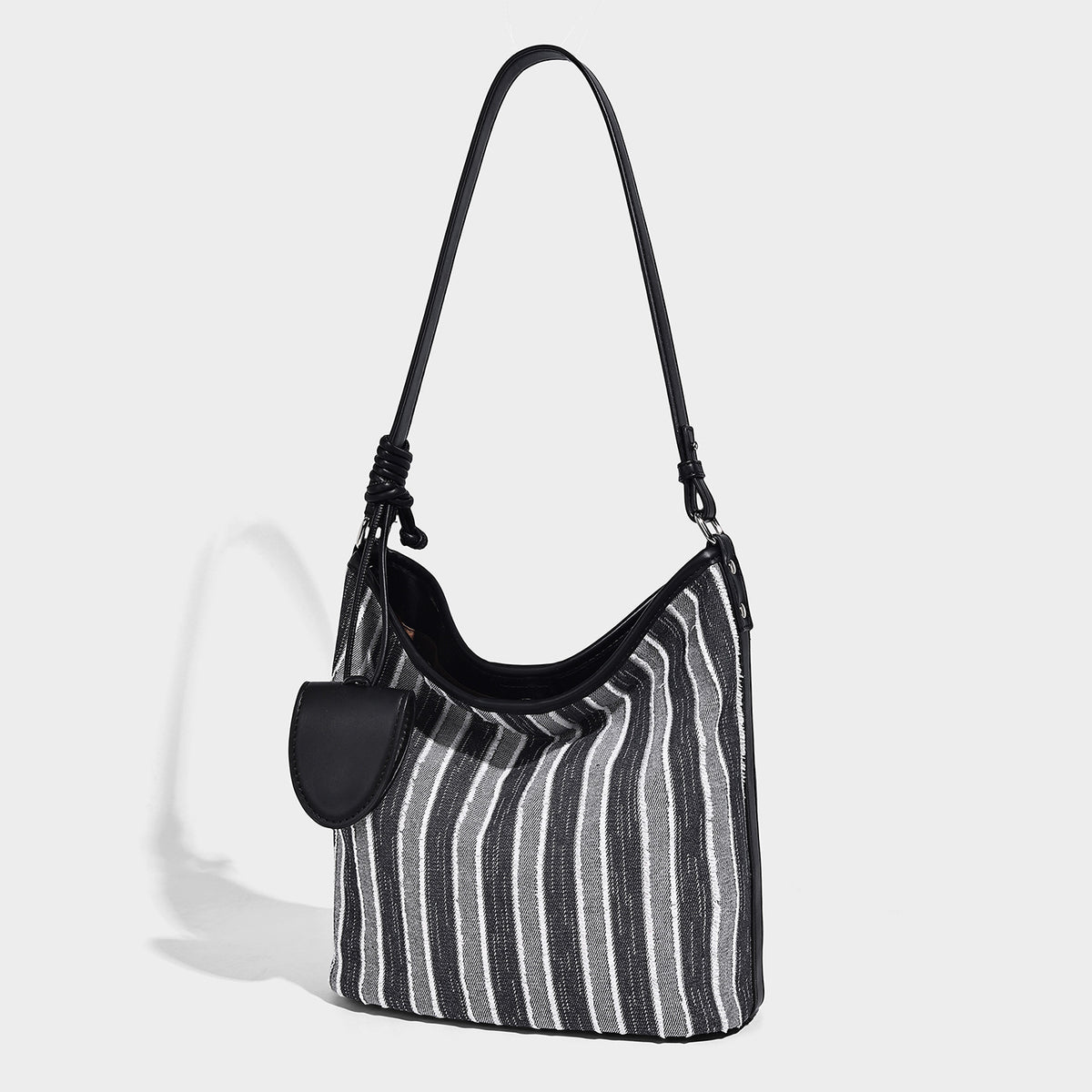 Large striped canvas hobo shoulder bag with cream trim and silver-tone hardware, detail view 4