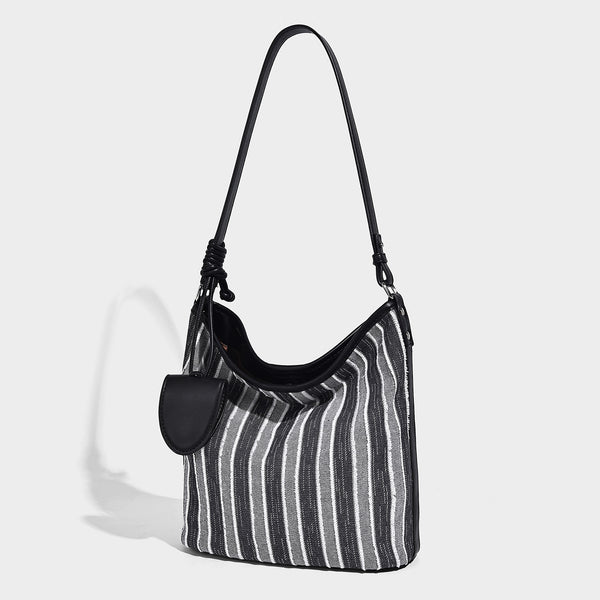 Large striped canvas hobo shoulder bag with cream trim and silver-tone hardware, detail view 4
