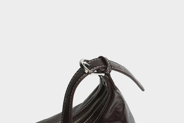 Slouchy hobo shoulder bag in glossy crinkled leather-look finish with zip-top closure and silver-tone ring hardware, detail