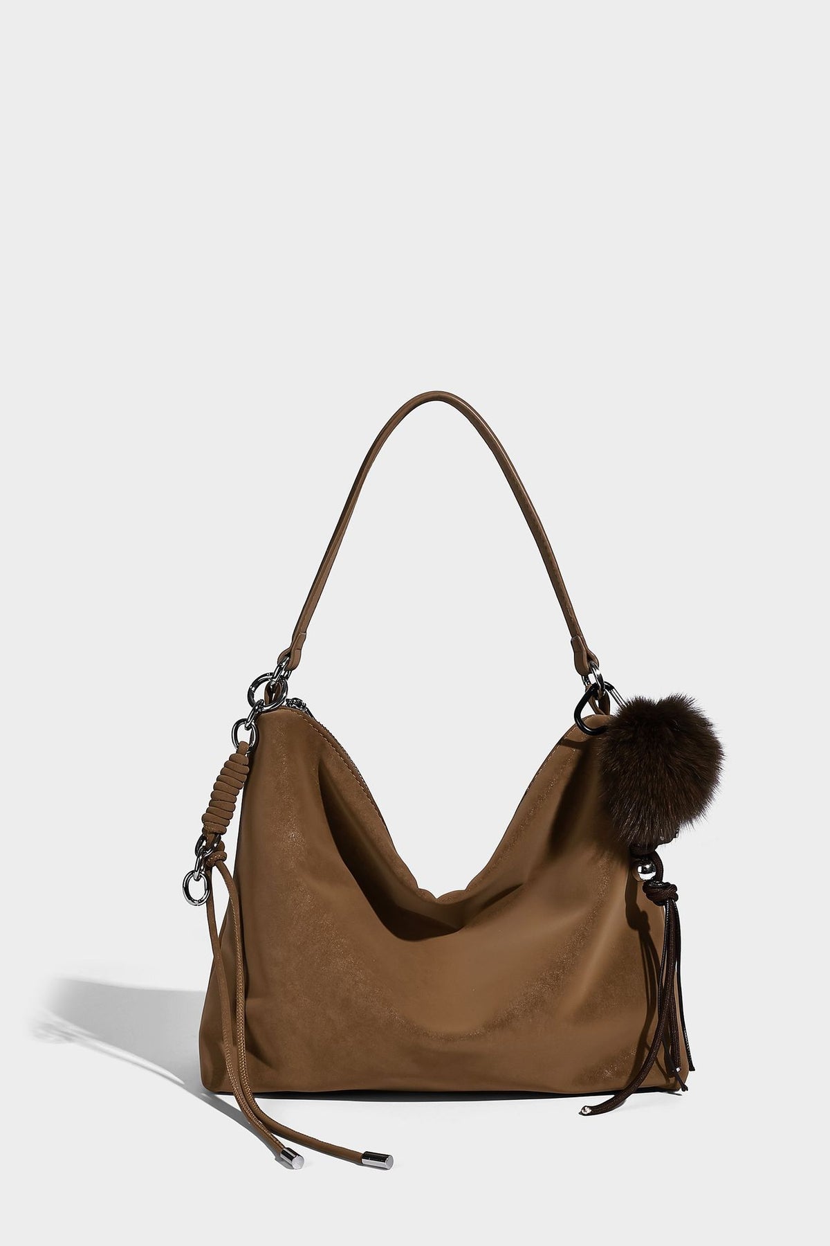 Slouchy matte-finish hobo shoulder bag with tassel cords, silver-tone hardware, and faux-fur pom charm, detail view 35