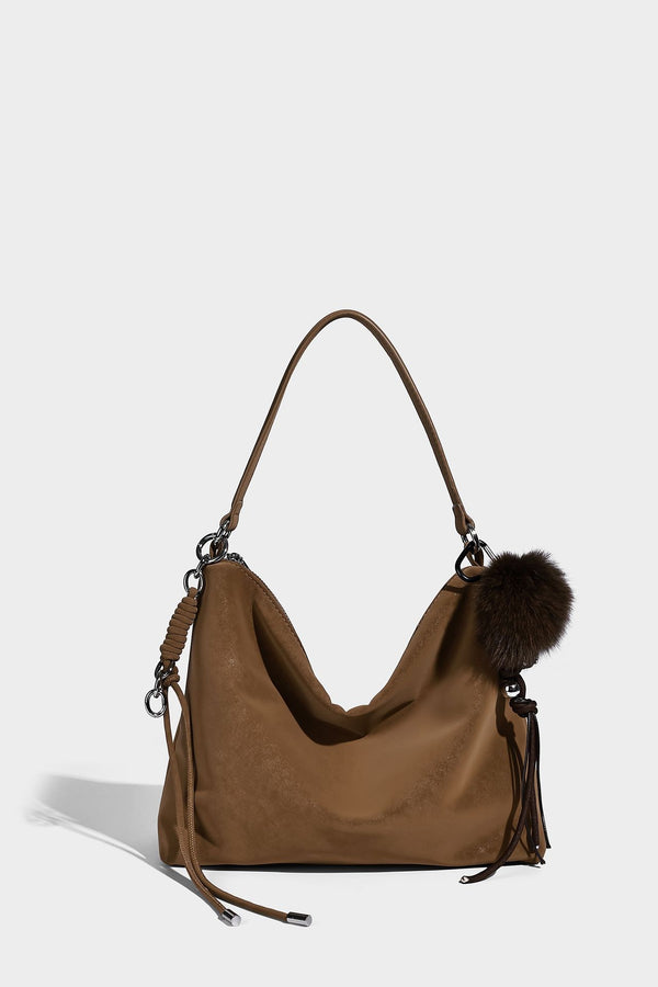 Slouchy matte-finish hobo shoulder bag with tassel cords, silver-tone hardware, and faux-fur pom charm, detail view 35
