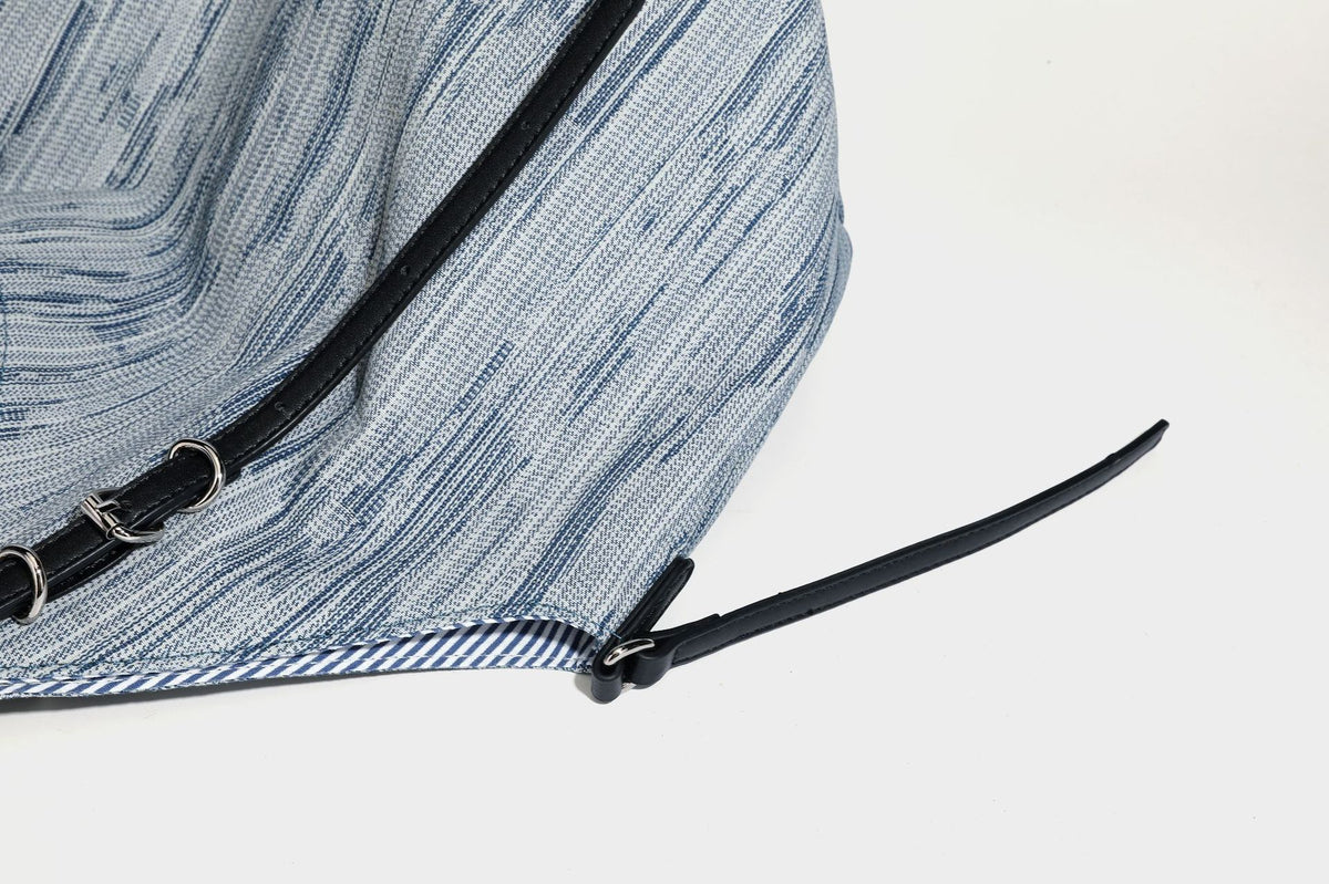 Large slouchy woven-texture shoulder tote bag with slim leather-look straps, side cinch ties, and silver-tone hardware