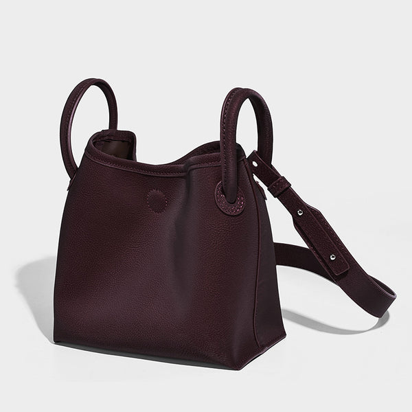 Small structured matte pebbled tote bag with twin top handles and removable zip pouch, detail view 6