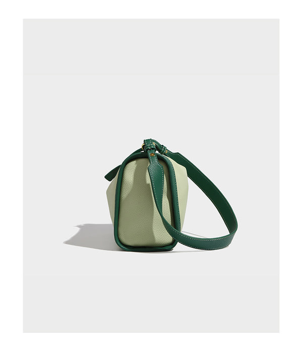 Structured two-tone shoulder bag with pebbled leather-look finish, contrast trim, top zip closure, and gold-tone hardware