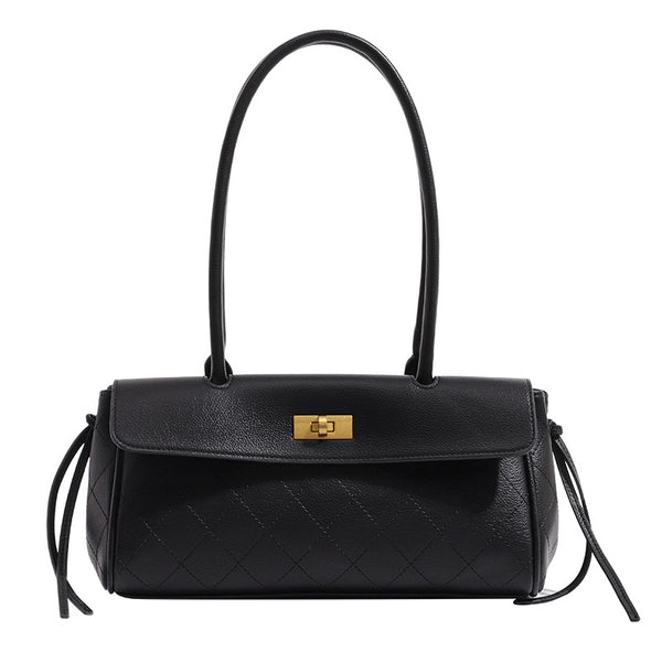 Structured quilted diamond top-handle underarm shoulder bag with gold-tone turn-lock flap closure and side tie straps, detail