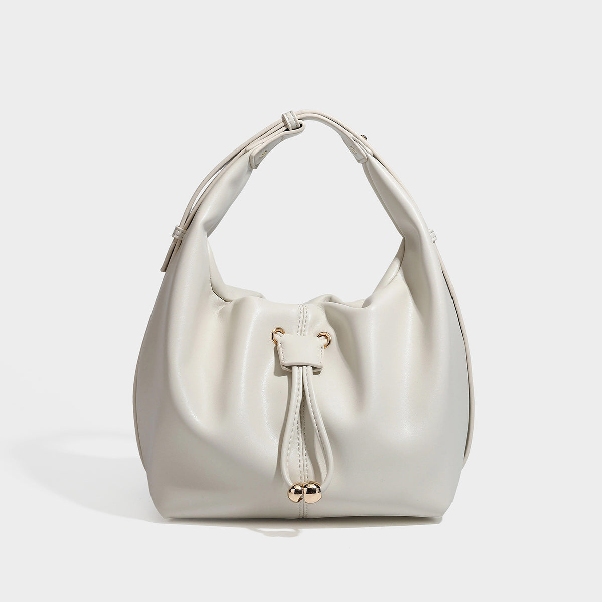 Slouchy hobo bag with smooth leather-look finish, drawstring cinch closure, and gold-tone bead hardware, detail view 3