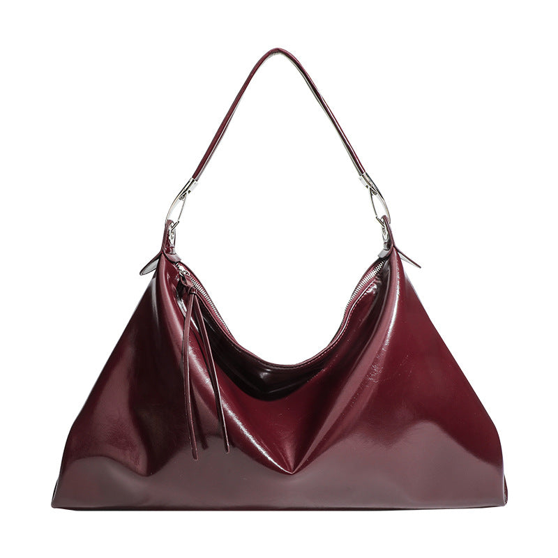 Glossy structured shoulder tote bag with silver-tone hardware and top zip closure, detail view 5