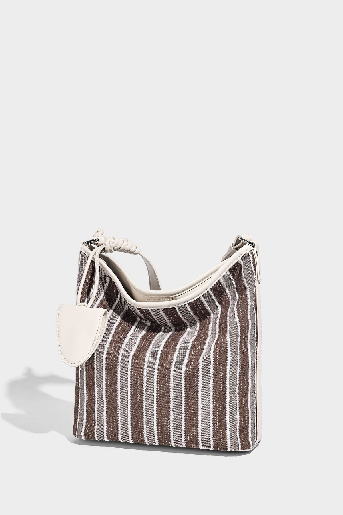 Large striped canvas hobo shoulder bag with cream trim and silver-tone hardware, detail view 12