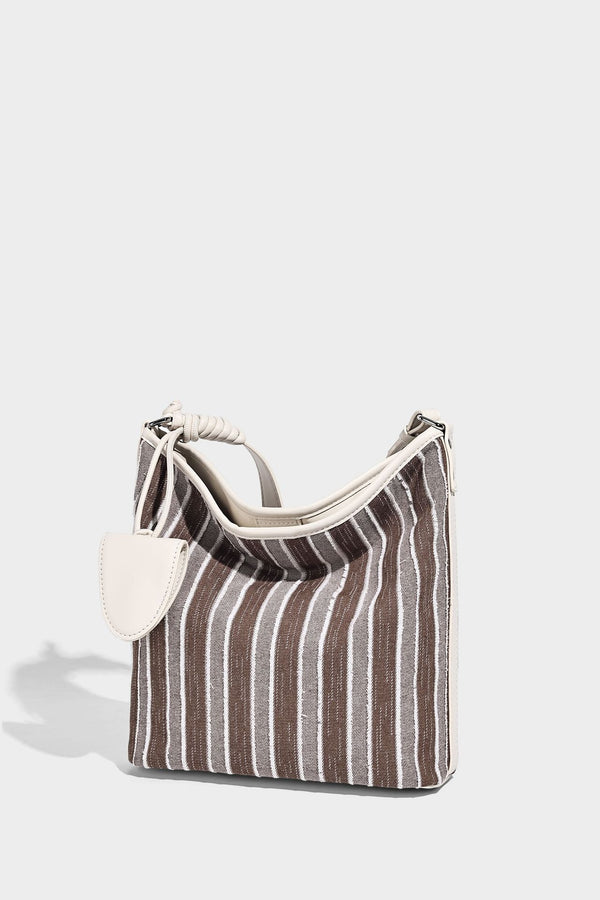 Large striped canvas hobo shoulder bag with cream trim and silver-tone hardware, detail view 12