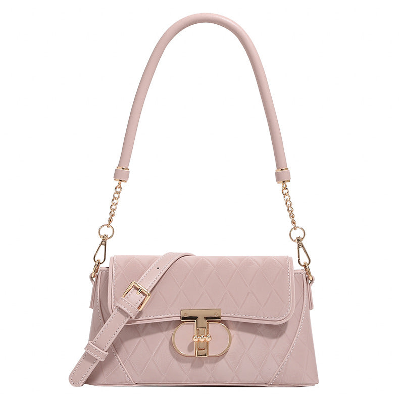 Small structured diamond-quilted flap bag with gold-tone turn-lock closure, chain shoulder strap, and cylindrical top handle