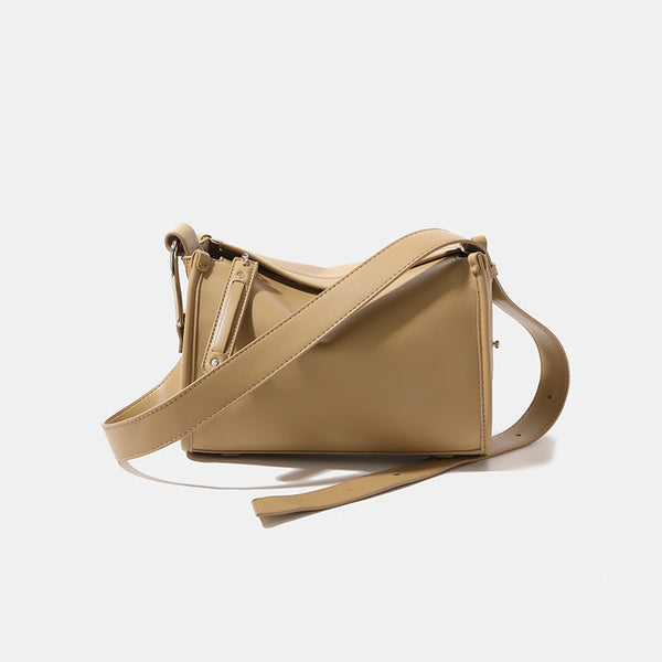 Structured smooth leather-look shoulder bag with top zip closure, tassel pull, and adjustable crossbody strap in khaki, front
