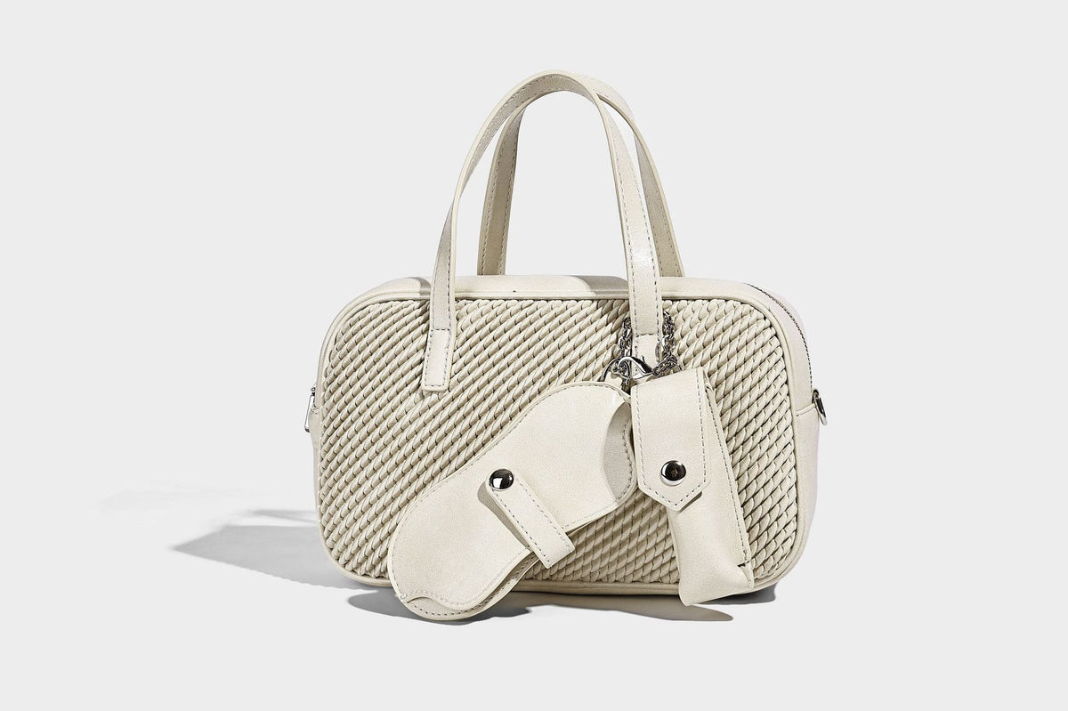 Structured woven-texture front top-handle handbag with zip closure, dual handles, detachable shoulder strap, and matching
