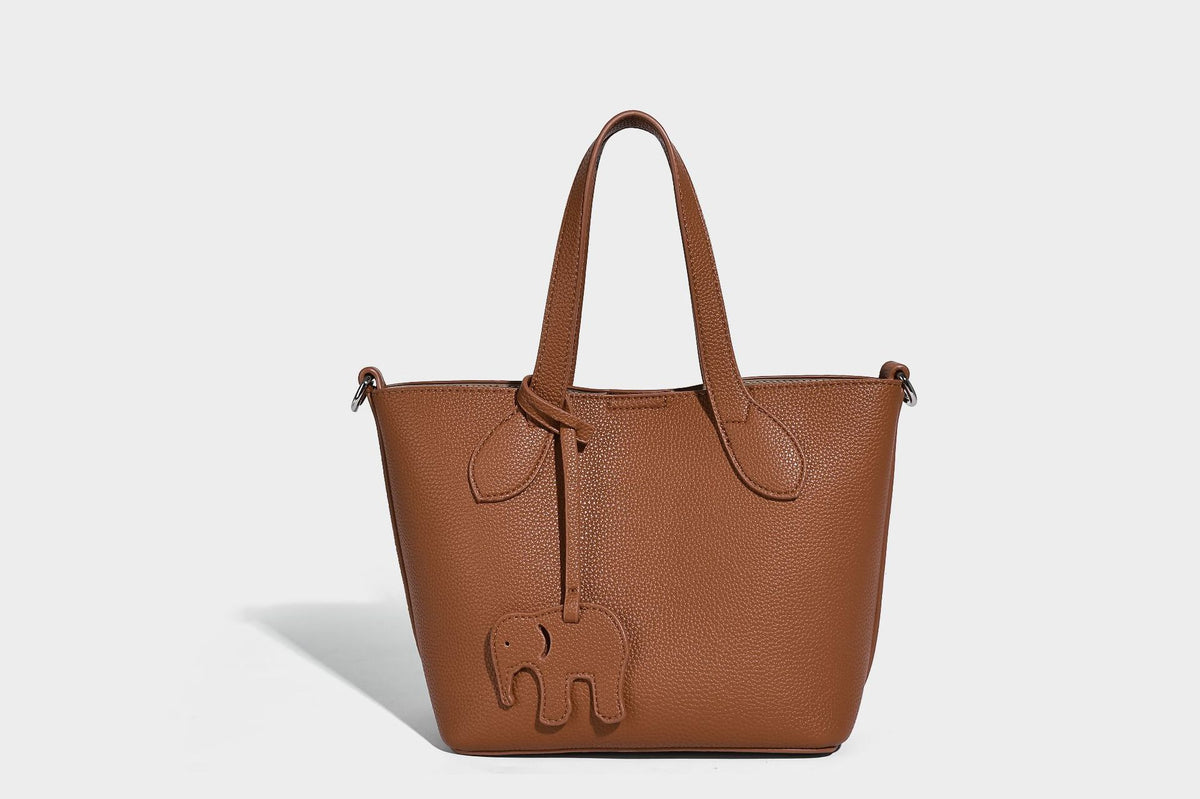 Compact pebbled bucket tote bag with elephant charm, twin top handles, and detachable crossbody strap, detail view 27
