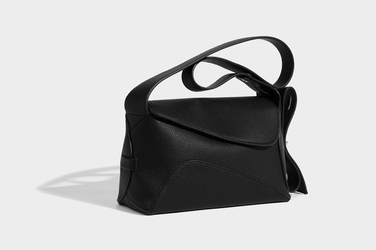 Structured curved-flap pebbled PU shoulder bag with sculptural loop strap detail, detail view 9