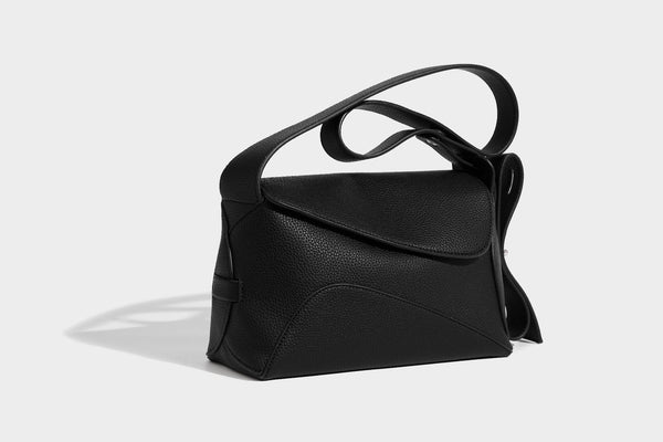 Structured curved-flap pebbled PU shoulder bag with sculptural loop strap detail, detail view 9
