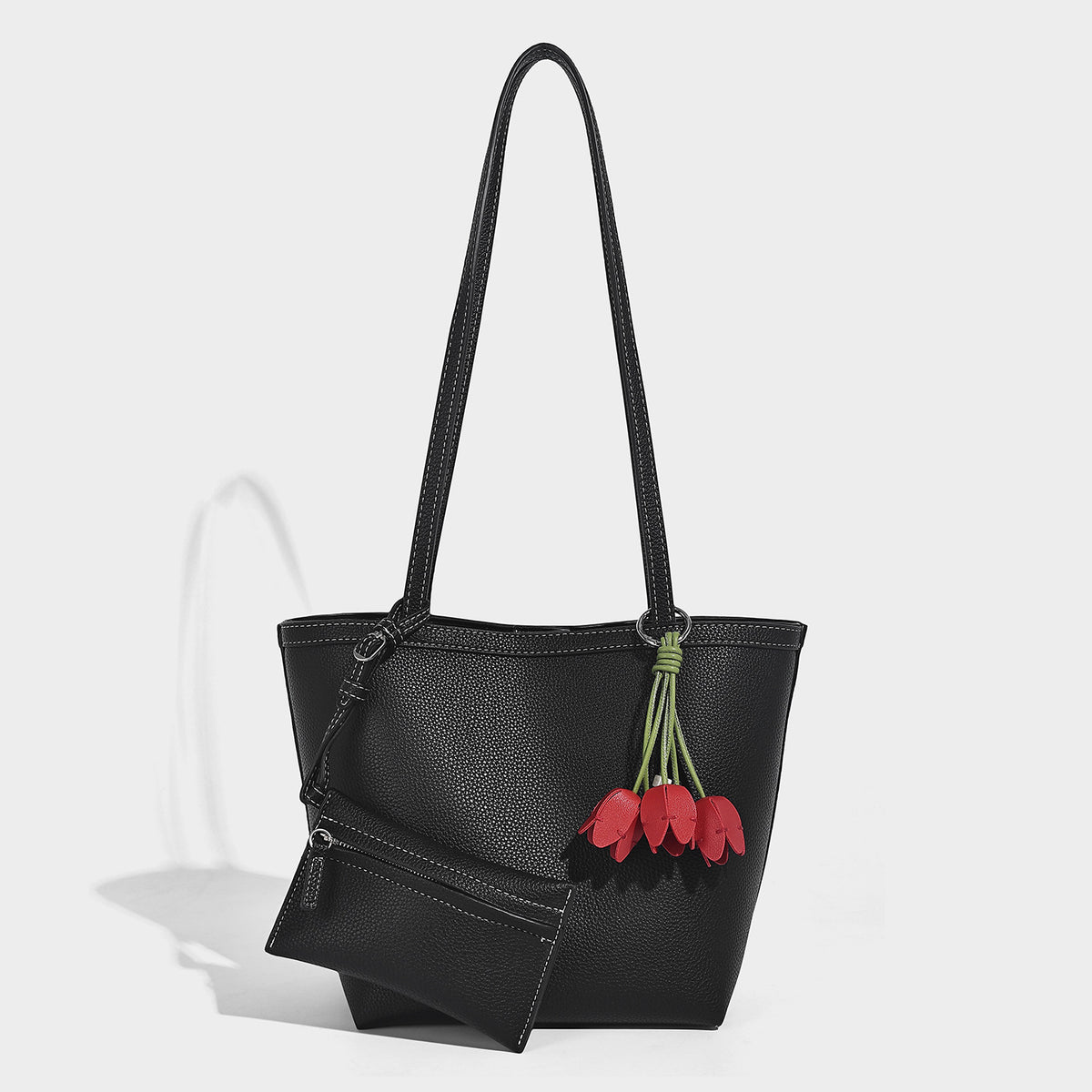 Structured pebbled leather-look tote bag in taupe with long shoulder strap, detachable zip pouch, and pink tulip flower