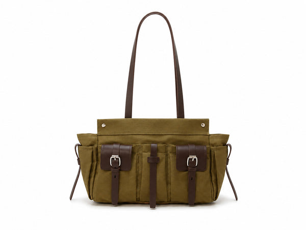 Large olive canvas shoulder tote bag with multiple front buckle-strap pockets and dark brown leather-look trim, detail view